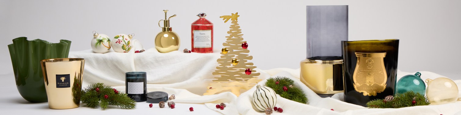 Luxury Christmas decorations featuring gold and green candles and festive ornaments