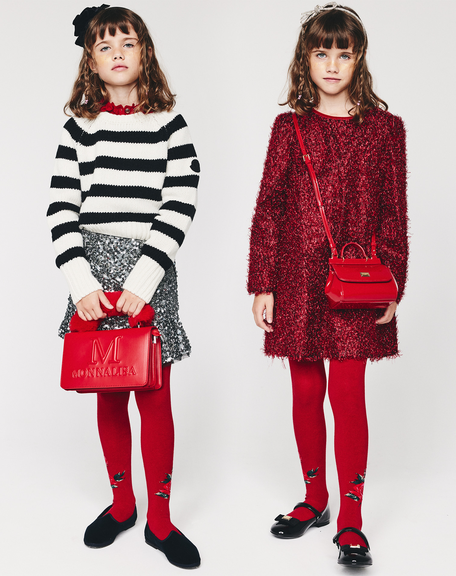 Two girls with red tights and purses