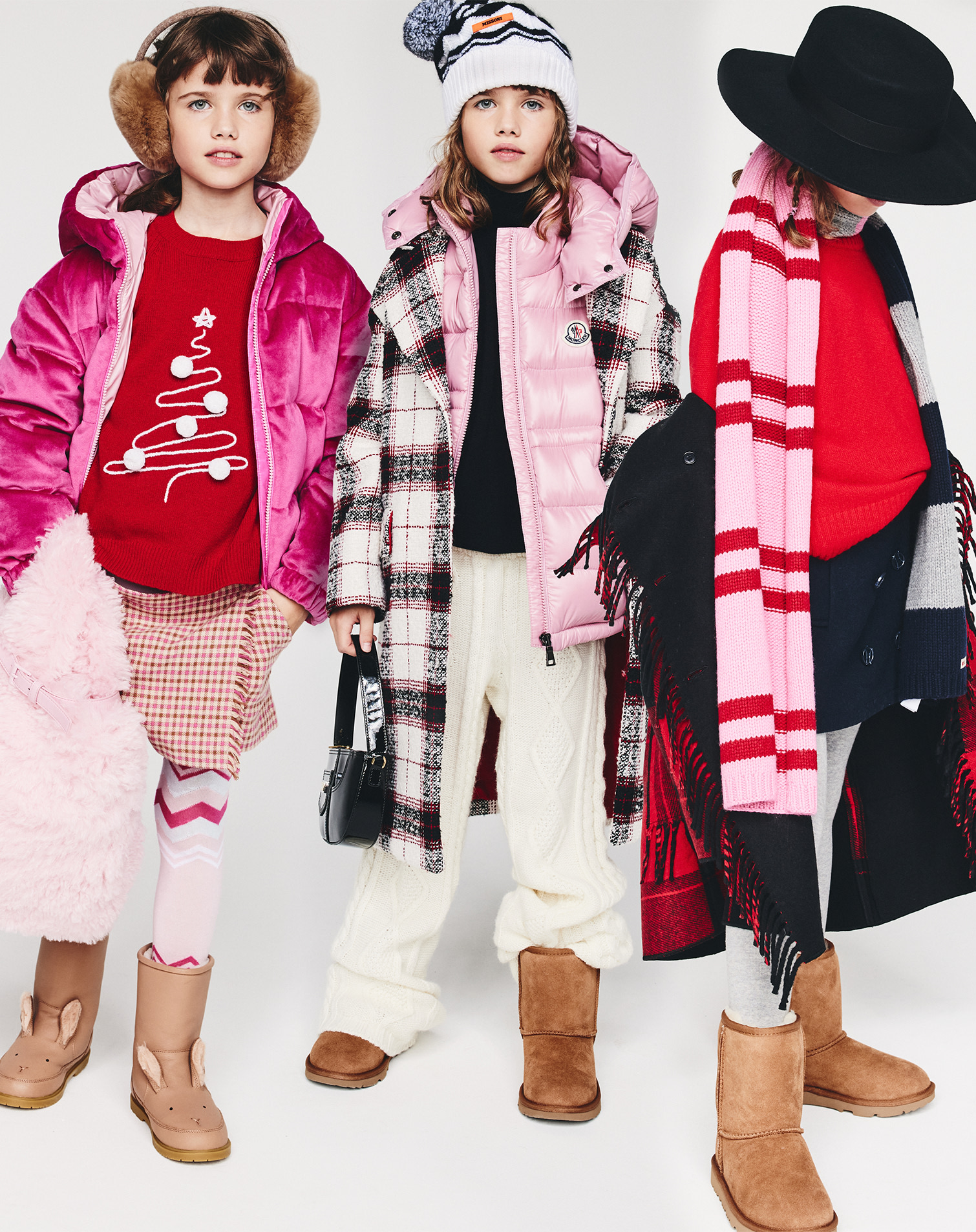 Three girls in UGG boots, moncler down jacket and scarves