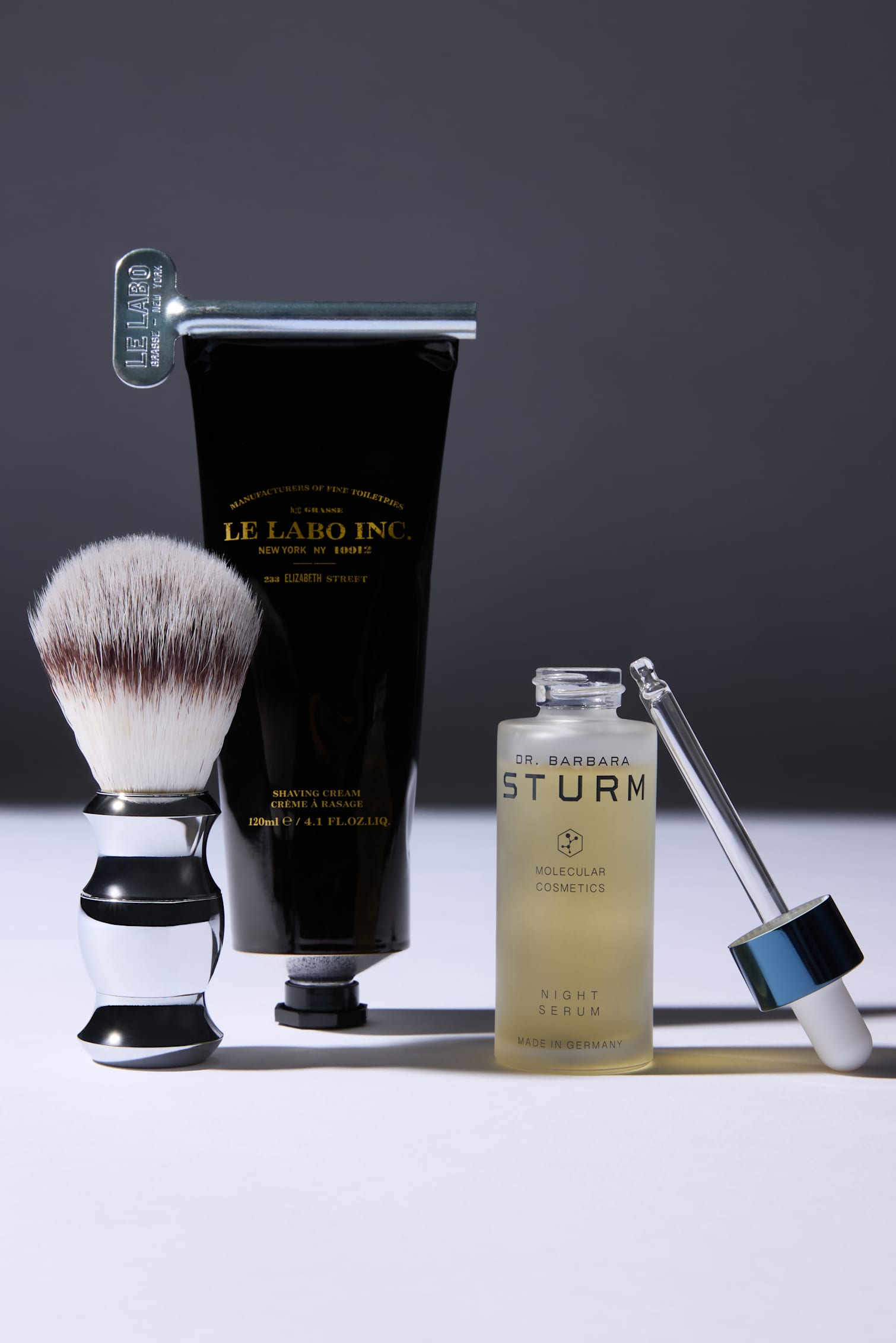 Le Labo shaving cream and brush beside Dr. Barbara Sturm Night Serum.