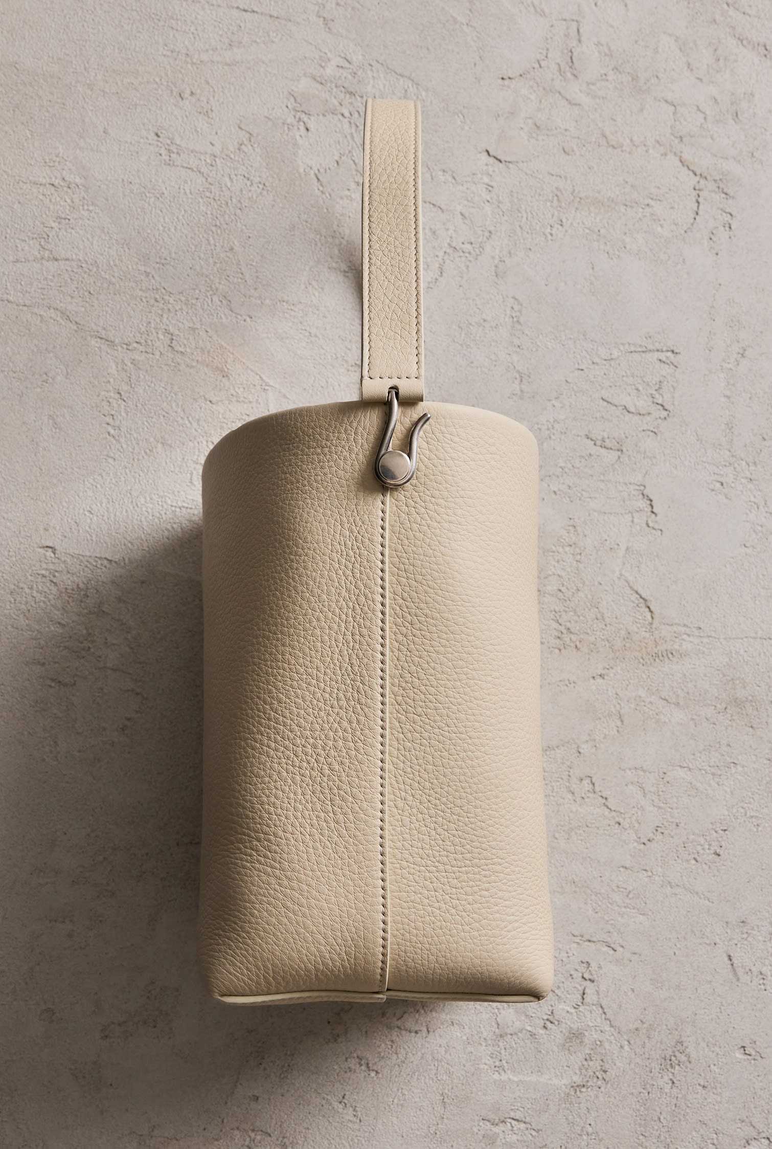 Focus on The Row cream-colored tote bag