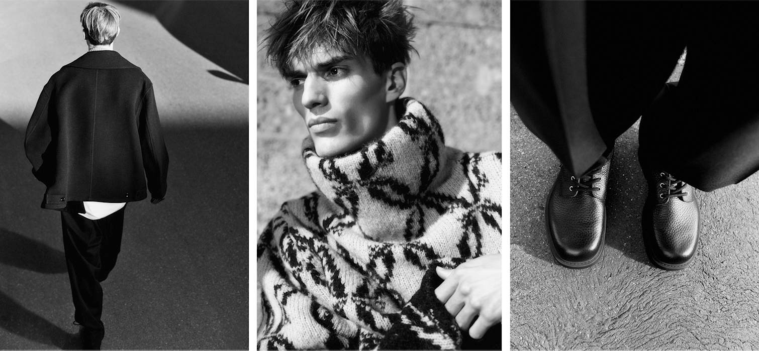 Das Model trägt einen schwarzen Pea Coat, einen Rollkragenpullover von Dries Van Noten und schwarze Schnürschuhe aus Leder.