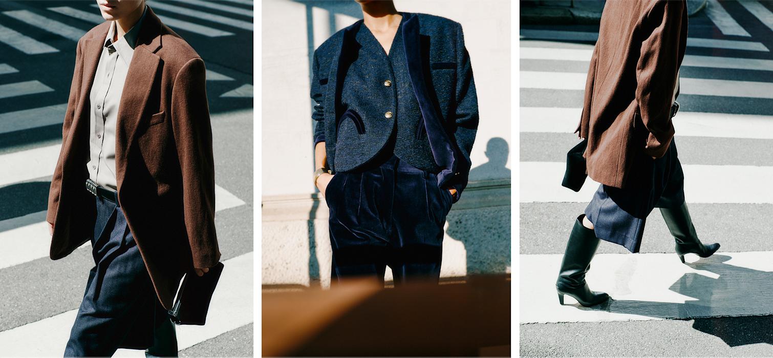 Das Model trägt einen braunen Blazer, ein beiges Hemd, lange schwarze Shorts von Bottega Veneta, hohe schwarze Stiefel von Chloé und einen kompletten Blazè Milano-Look.