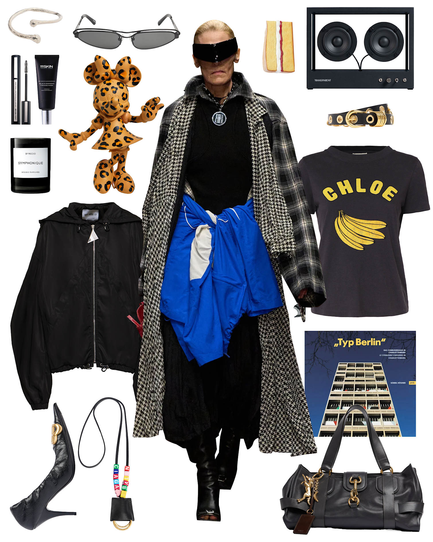 Typischer Berliner Look mit schwarzen Fashion-Pieces, Sonnenbrille und auffälligem Schmuck