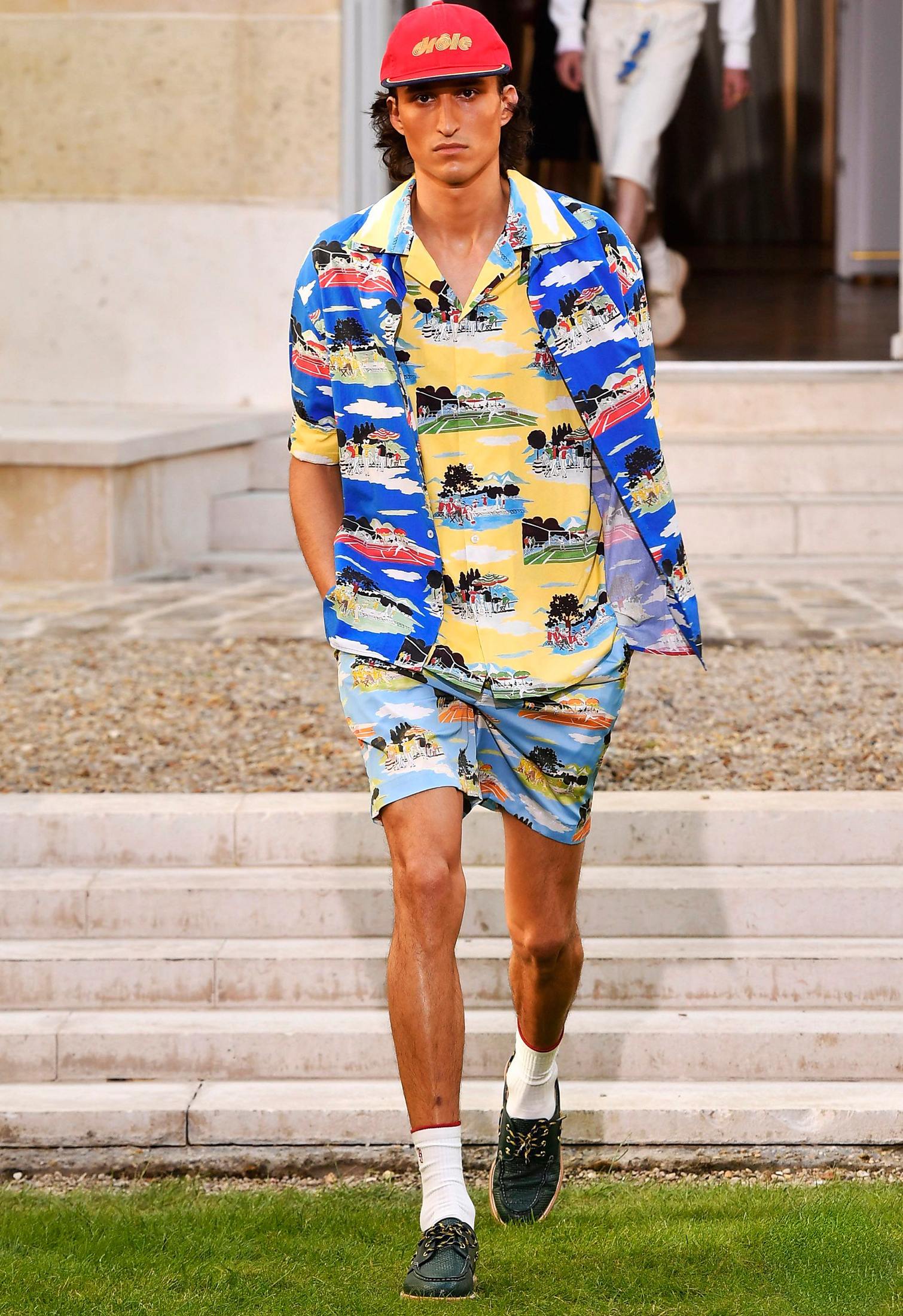 blue boat shoes and layered printed bowling shirts and shorts