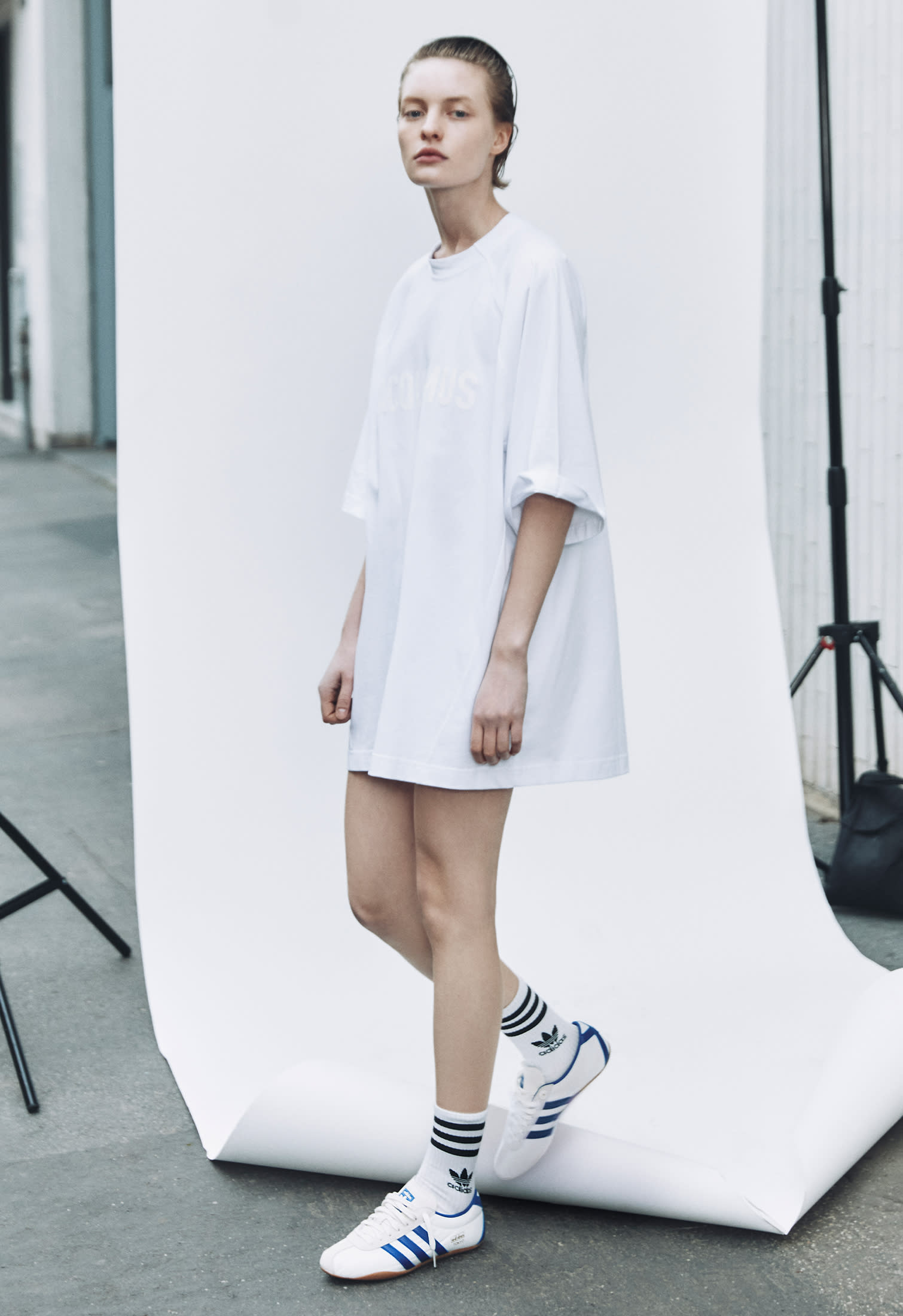 oversized t-shirt worn as mini dress with striped sneakers