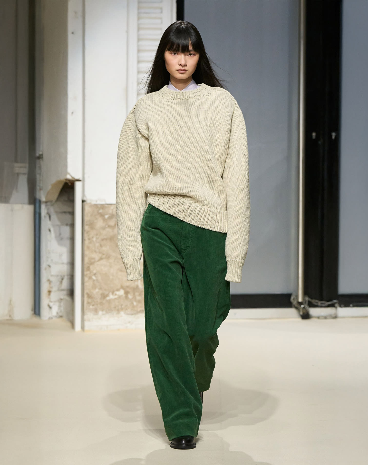 Runway look with beige sweater and green pants