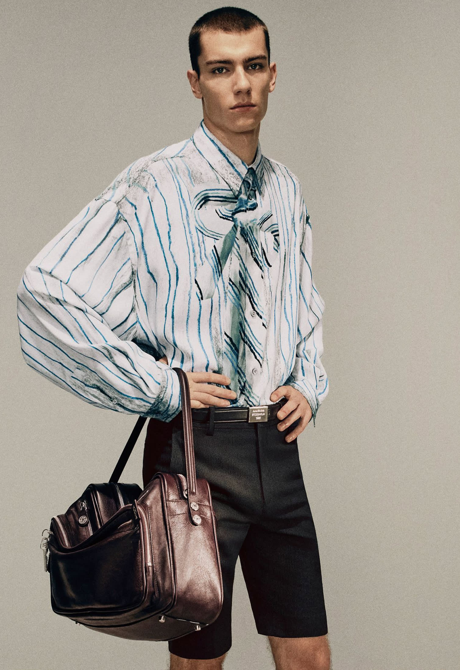 Leather travel bag with shoulder strap, organizational compartments by Acne Studios