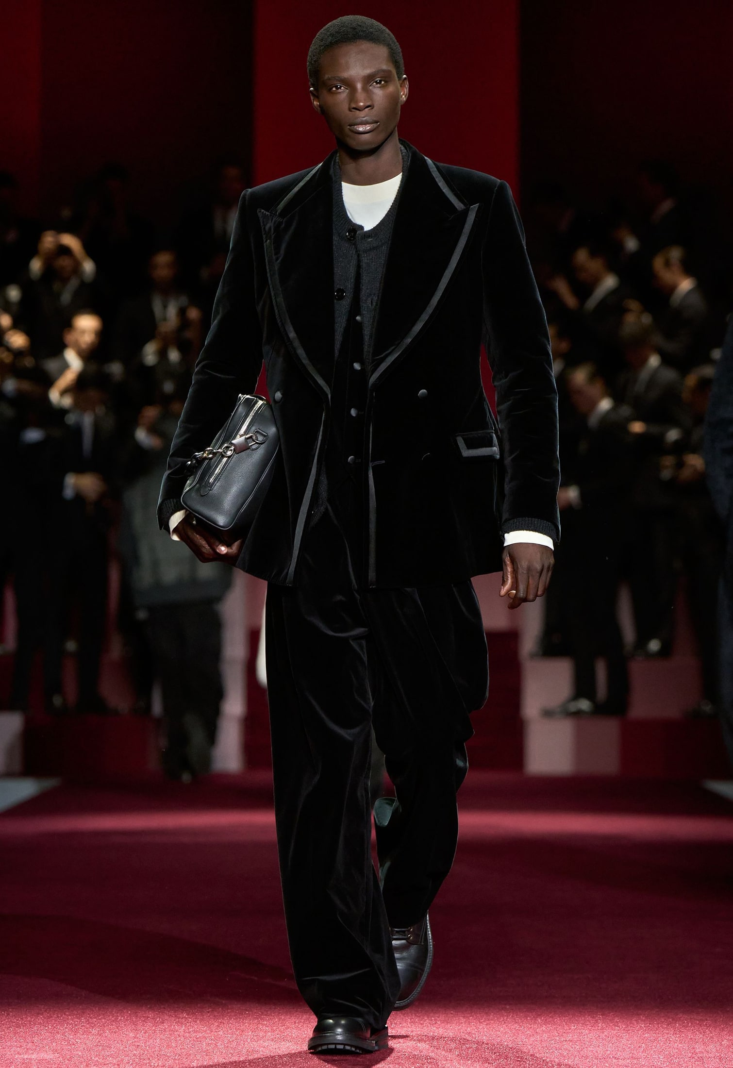 Dolce&Gabbana black velvet suit with grosgrain trim completed with leather bag and boots