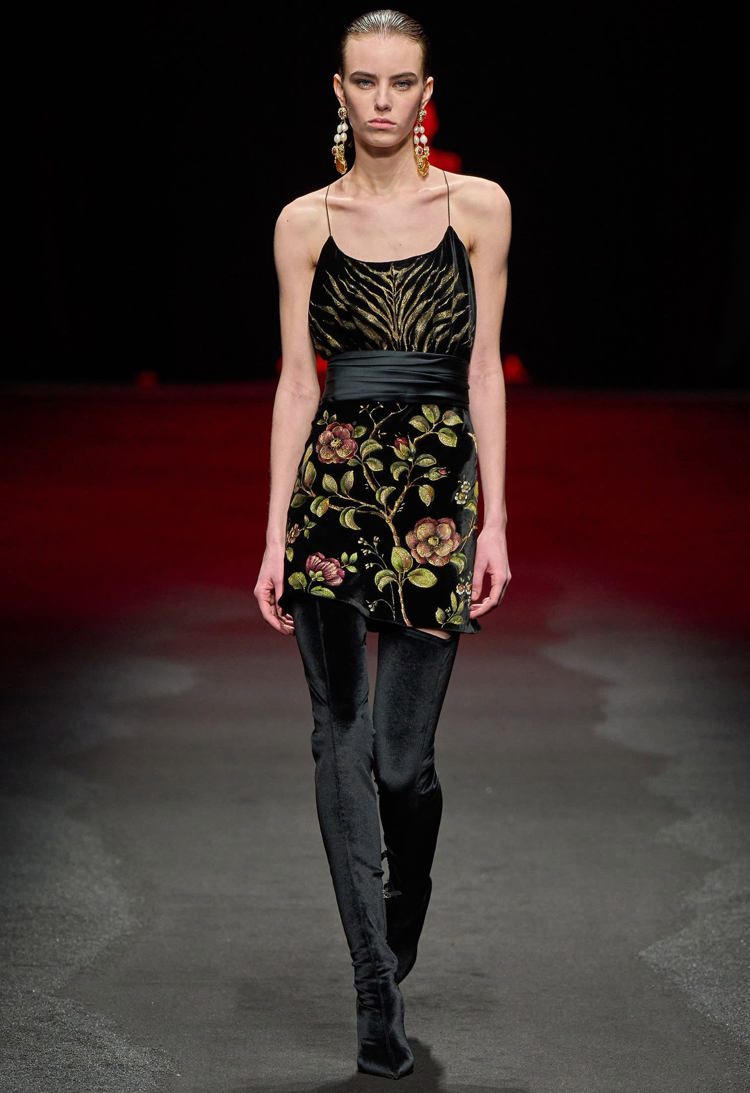 Model with over-the-knee black satin boots