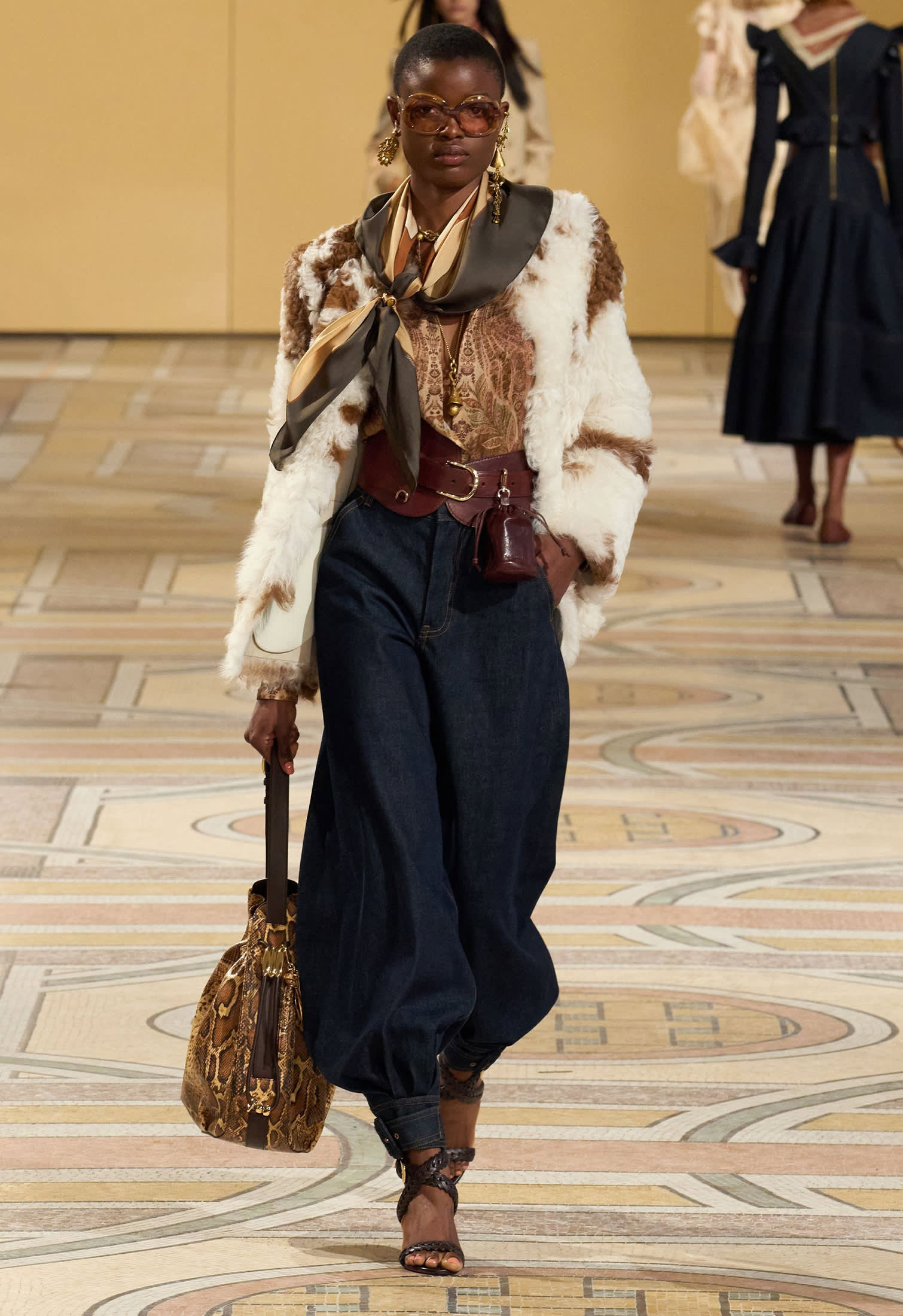 Model in runway with Cropped shearling jacket by Zimmermann
