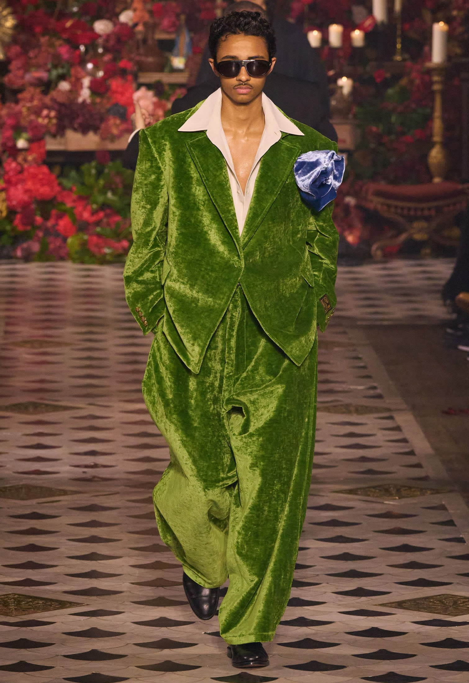 Model male with oversize green velvet men suit