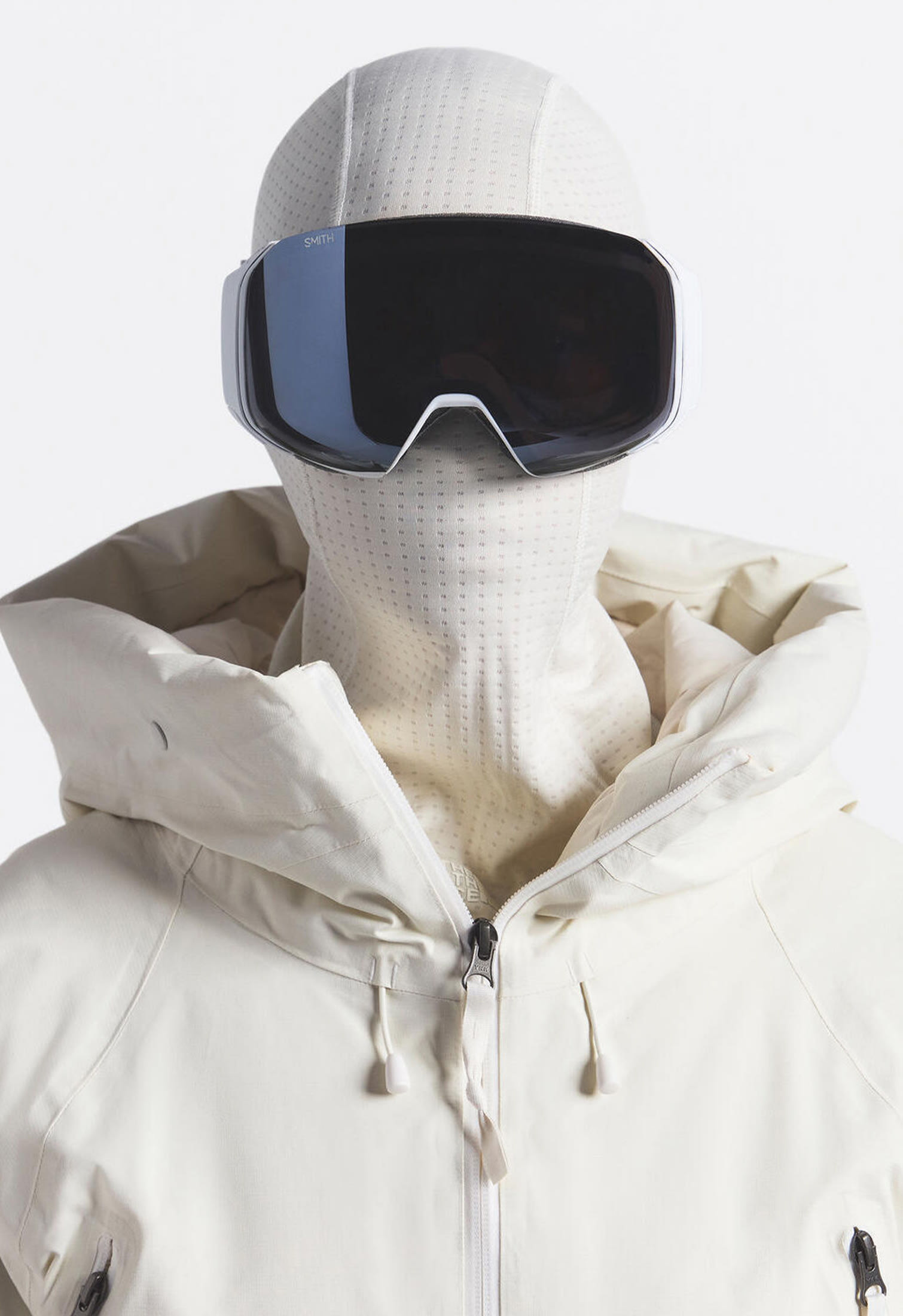 Model with big ski sunglasses, dotknit balaclava and ski jacket from The North Face x Skims