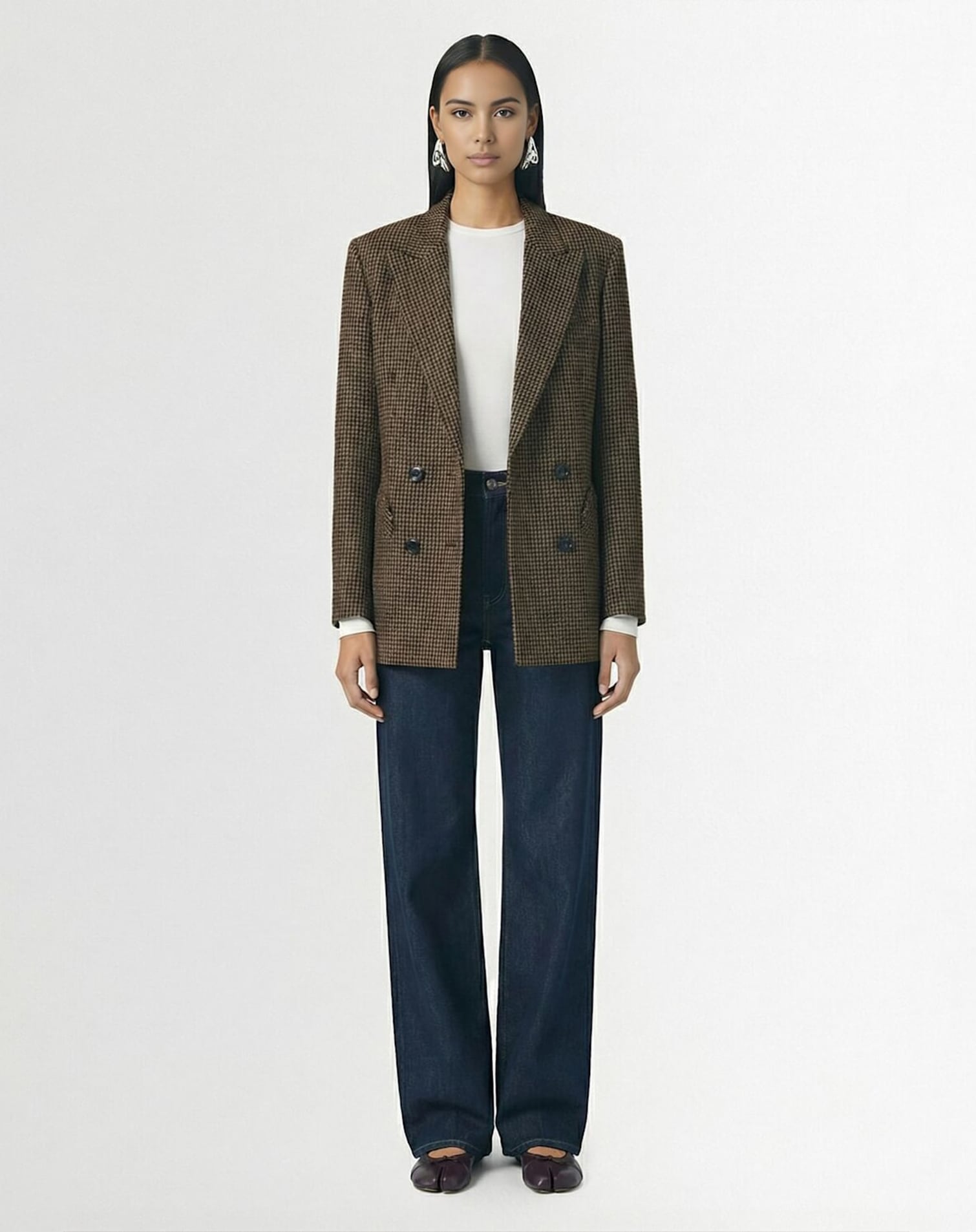 Woman wearing a tailored blazer and jeans styled as a casual Valentine’s Day outfit